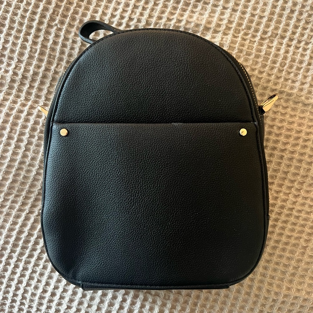 Black mini backpack with gold hardware